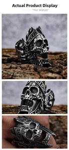 Macro shot of gothic skull warrior ring in vintage steel on tree bark and finger