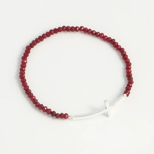 Religious beaded bracelet with red multifaceted stones and a silver cross pendant