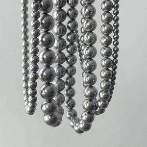 Elegant multi-strand metallic grey faux pearl necklace with mirror luster finish