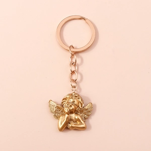 Close-up of a golden cupid angel keychain with a polished finish and ring attachment