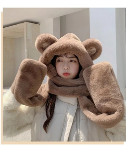 Detailed texture of brown plush bear hat scarf and gloves combo set for winter