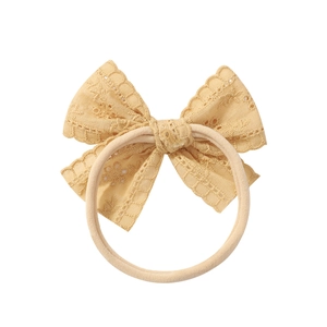 Soft beige lace bow baby headband with elastic hollow design for newborn girls