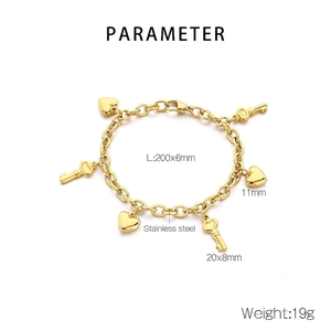 Detailed view of gold stainless steel heart and key pendants with size specifications