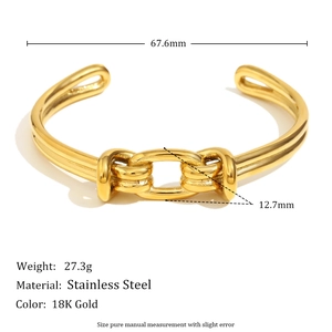 Detail of 18K gold plated stainless steel cuff bracelet featuring a double knot chain design