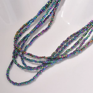 Macro detail of 2mm iridescent hematite cube beads for DIY jewelry making and crafts
