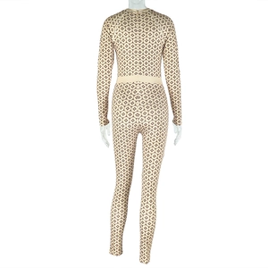 Detailed back view of a slim-fit long-sleeve jumpsuit with geometric diamond patterns