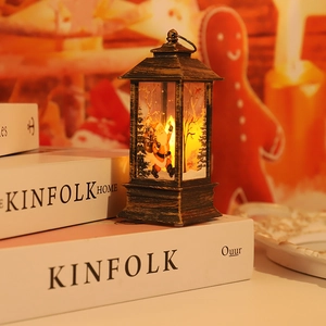 Detail of vintage Christmas lantern with Santa Claus scene and warm LED light