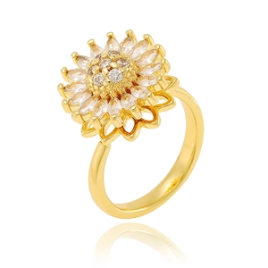 Detailed macro shot of a golden sunflower rotating ring featuring white zircon stones