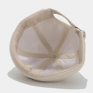 Inside view of beige cotton docker hat showing the adjustable strap and seam details
