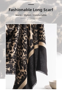 Detailed view of leopard print cashmere scarf with fringe edges and soft texture