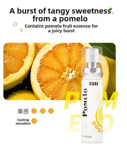 Macro shot of 20ml portable pomelo breath spray bottle with fresh fruit background