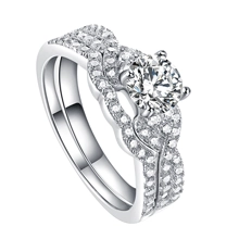 Detailed view of silver s925 ring set with large round center diamond and pave accents