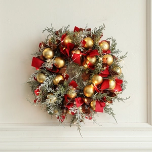 Luxury 40cm Christmas wreath with red berries, pine needles, and LED string lights on wood