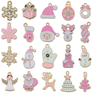 Pink and white Christmas alloy pendants including snowflakes, Santa, and reindeer charms
