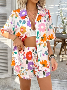 Outdoor shot of bohemian colorful floral print shirt and drawstring shorts set for women