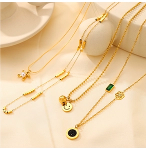 Detailed collection of gold plated titanium steel necklaces with diverse pendants on stones