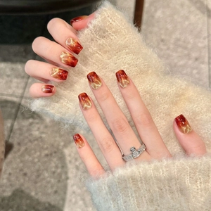 Burgundy cat-eye press-on nails with golden gradient shimmer and short square shape