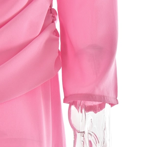 Detailed view of the pink chiffon dress sleeve showing soft fabric texture and fine stitching