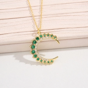 Elegant gold crescent moon necklace with emerald green zircon and micro-pave crystals
