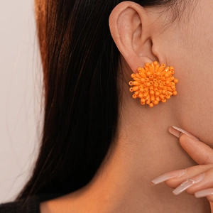Chic orange beaded flower earrings with 3D handmade woven petals for fashion jewelry style