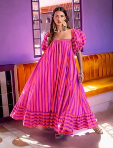 Detail of puff sleeves and orange striped fabric on a bohemian maxi summer dress