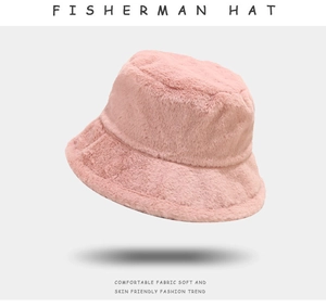 Detail of pink plush faux fur fisherman hat showing soft texture and cozy fabric