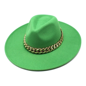 Close-up of bright green wool fedora hat featuring a chunky gold metal chain detail