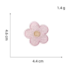 Detail of pink macaron flower embroidery patch with size measurements 4.6cm by 4.4cm