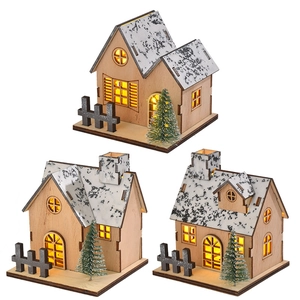 Three illuminated wooden Christmas house ornaments with warm LED lights and snowy trees
