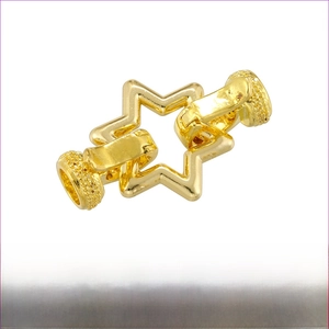 Macro shot of gold-plated brass star jewelry clasp with size and weight detail
