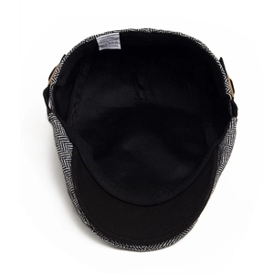 Retro herringbone pattern flat cap in black and white with cotton lining and internal label