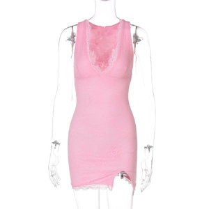 Close-up of pink floral lace texture and intricate hemline embroidery on a V-neck dress
