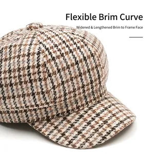 Brown houndstooth newsboy cap with wide foldable brim for face contouring effects