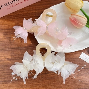 Elegant butterfly hair claw clip with tulle wings and pearls for floral hair styling