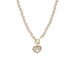 Elegant pearl necklace with gold beads, toggle clasp, and zircon heart shell pendant
