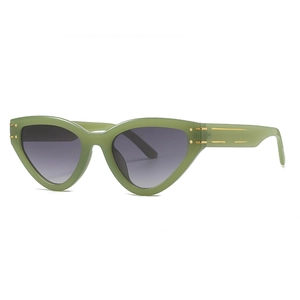 Retro cat-eye sunglasses with dark green frames and gradient lenses for stylish women