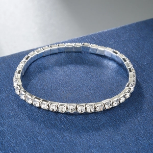 Close-up of a single row silver tennis bracelet featuring brilliant round-cut crystals