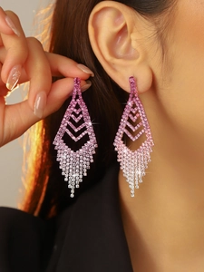 Detail of elegant gradient pink rhinestone long tassel earrings worn by a model