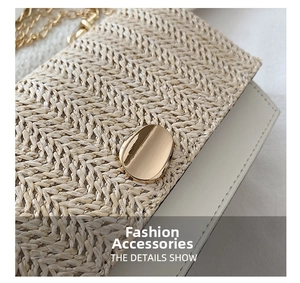 Detail of woven texture handbag featuring gold clasp and metal chain strap