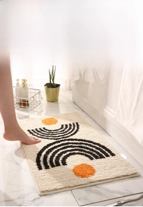 Detail of minimalist absorbent bathroom mat with geometric pattern and thick plush texture