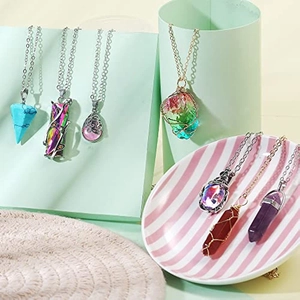 Detail of 14-piece bohemian moonstone and crystal pendant necklace set displayed on stands