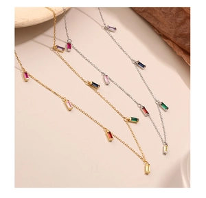 Detail showing gold and silver 925 sterling necklaces with colorful zircon stones