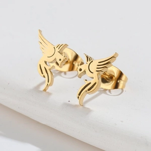 Minimalist 18K gold plated bird earrings on white stone background in a pair set