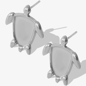 Detail of silver turtle-shaped stud earrings in polished 304 stainless steel material