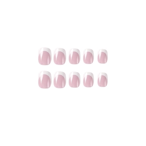 Short round French press-on nails in lavender pink base with classic white tips