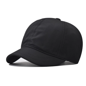 Detail of black quick-dry short brim baseball cap showing fine fabric texture and stitching