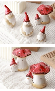 Detail of vintage ceramic Santa and snowman figurines on a cozy textured blanket