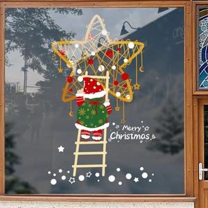 Adesivi natalizi per finestre con Babbo Natale e stelle dorate su vetro