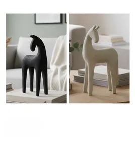 Minimalist abstract horse resin sculptures in black and beige with sand-like texture