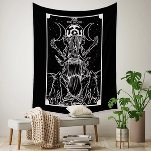 Detail of black and white Tarot The Moon tapestry hanging as a bohemian wall decor feature